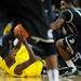Michigan freshman Caris LeVert scrambles for the ball in the second half against Michigan State at Crisler Center on Sunday, March 3, 2013. Melanie Maxwell I AnnArbor.com